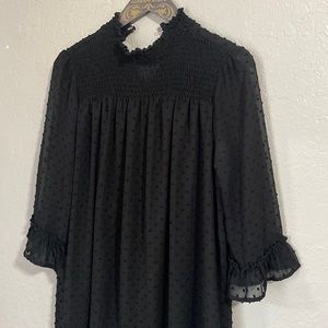 Black mini dress with long sleeves and polka-dots